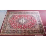 A central Persian Kashan carpet with central double pendant medallion and repeating spandrels and