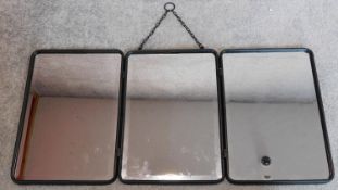 A metal framed triple section wall hanging mirror. 40x85cm