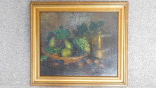 A framed oil on board, still life painting of a basket of fruits, signed by Szada. 55x64cm