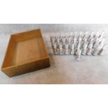 A large collection of miniature saki bottles. H.11cm