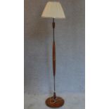 A 1970's vintage teak standard lamp. H.166cm