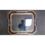 A continental style lozenge shaped wall mirror. 100x86cm