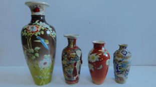 A collection of 4 Oriental ceramic vases, to include a Satsuma vase. 38x16cm.