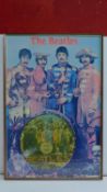 A framed poster of The Beatles, Sgt Peppers Lonely Hearts Club Band, inset with a vinyl picture disc