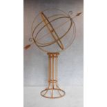 A large full height metal garden armillary sphere with revolving central globe. H.205cm