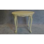 A white painted French style centre table. H.60 W.70cm