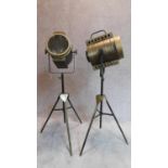A pair of vintage style spotlights on tripod bases H.109cm