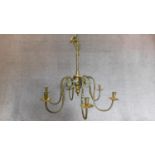 A brass Dutch style six branch chandelier with candle sconces 85x85cm (unwired)