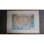 An oak framed and glazed Bacon's Standard map of the United States. 103x73cm