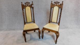 A pair of Victorian oak hall chairs, with barley twist supports and velour upholstery, raised on