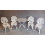 A Colebrookdale style garden table and the four matching chairs. H.84
