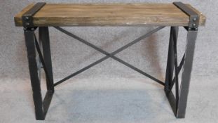 An industrial style metal framed bench with planked top. 62x94x31cm