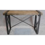 An industrial style metal framed bench with planked top. 62x94x31cm