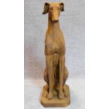 A seated metal figure of a greyhound. H.83cm