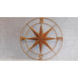 A large decorative metal compass. 104x104cm