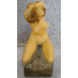 An unusual novelty telephone in the form of a naked woman. H.26cm