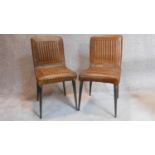 A pair of vintage style leather upholstered side chairs on metal tubular tapering supports. H.90cm