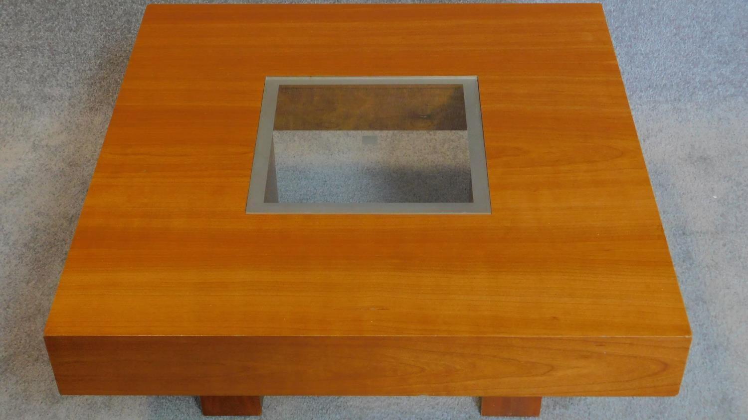 A low beechwood coffee table with inset glass top. 33x70x70cm - Image 2 of 3