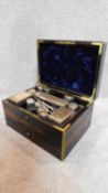 A mid 19th century Asprey coromandel and brass bound fitted dressing table box with inset brass labe