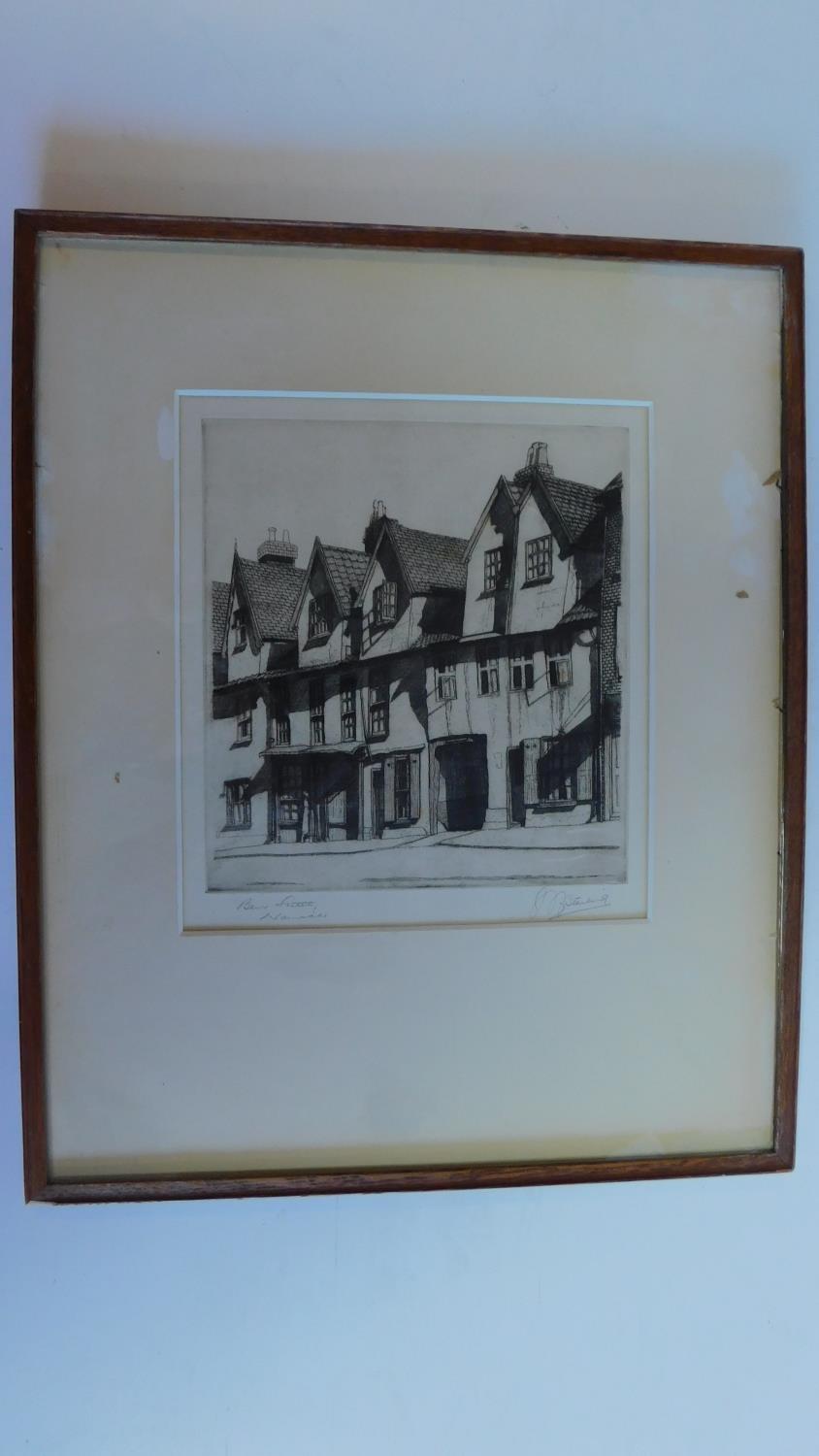 A framed and glazed etching, Norwich street. signed H. J. Starling. 46x38cm.