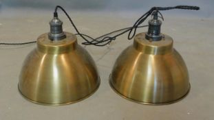A pair of industrial style brass ceiling light pendants, H.30 D.33cm