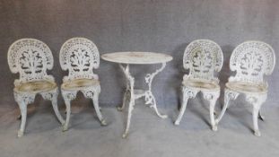 A Colebrookdale style white painted garden table and 4 matching chairs. H.84cm