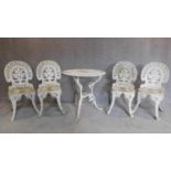 A Colebrookdale style white painted garden table and 4 matching chairs. H.84cm