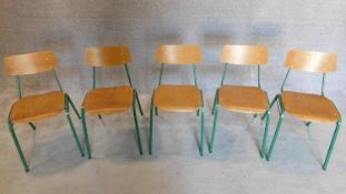 A set of five vintage children's metal framed stacking chairs with plywood backs and seats. H.67cm