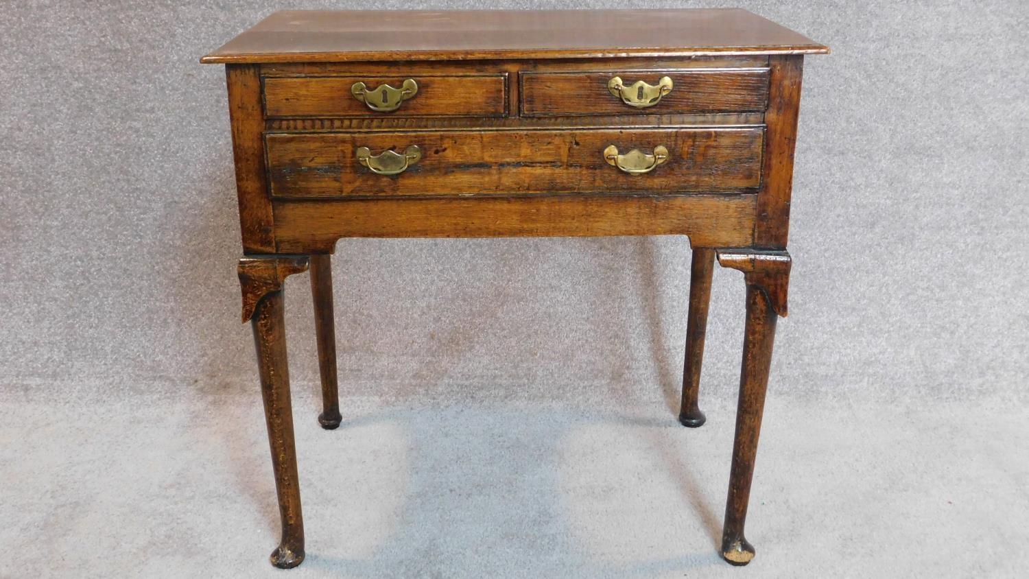 A Georgian country oak lowboy, fitted drawers on cabriole supports. 70x72x45cm