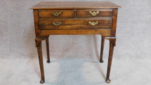 A Georgian country oak lowboy, fitted drawers on cabriole supports. 70x72x45cm