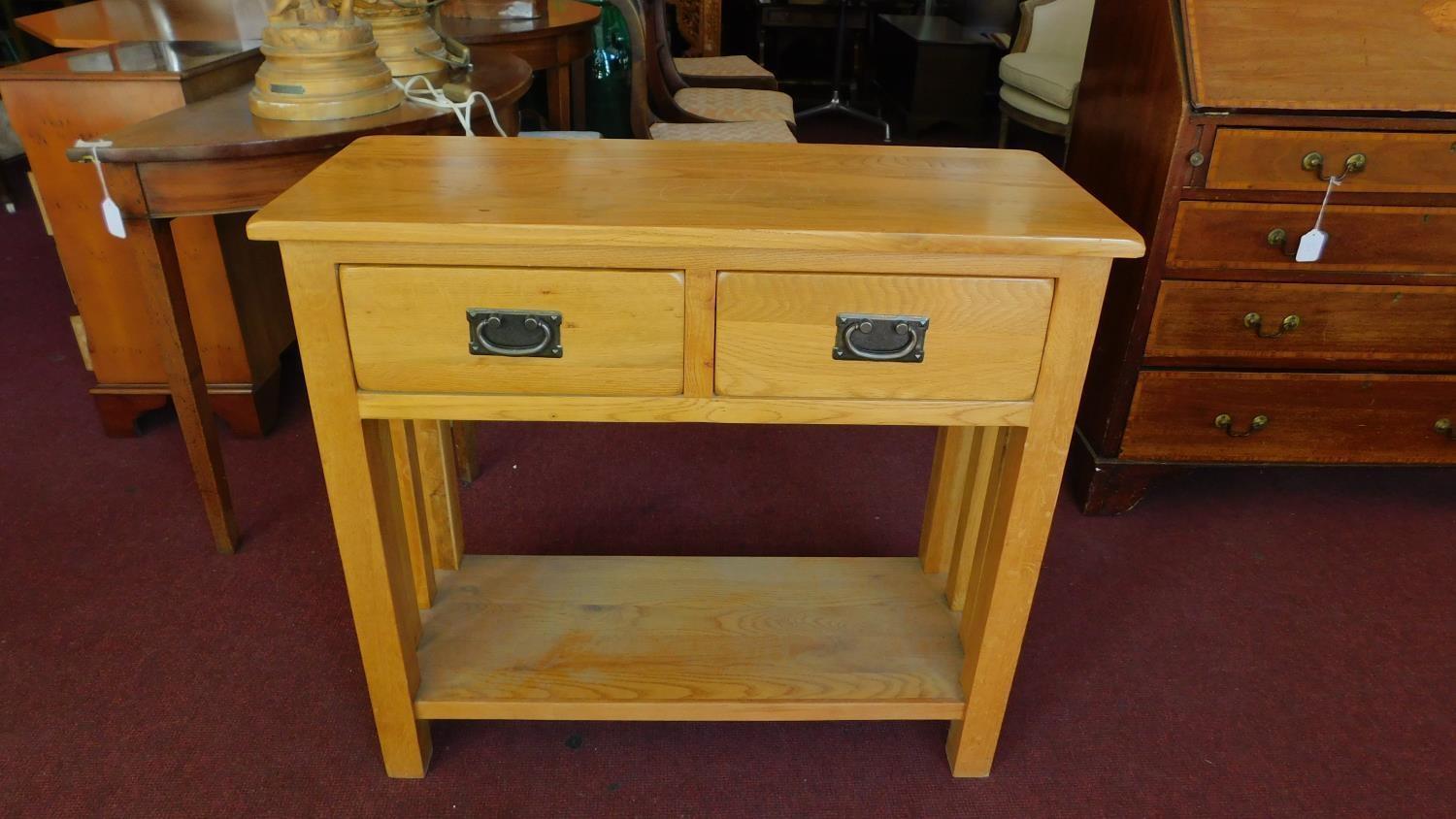 A teak Art Nouveau style side table H.77 W.85 D.35