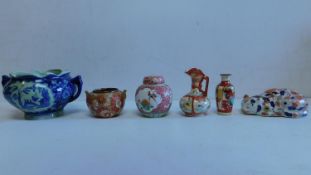 A collection of 6 items of Oriental porcelain and ceramics, to include a Chinese sleeping cat and