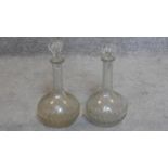 A pair of 19th century cut and etched glass decanters. H.32cm