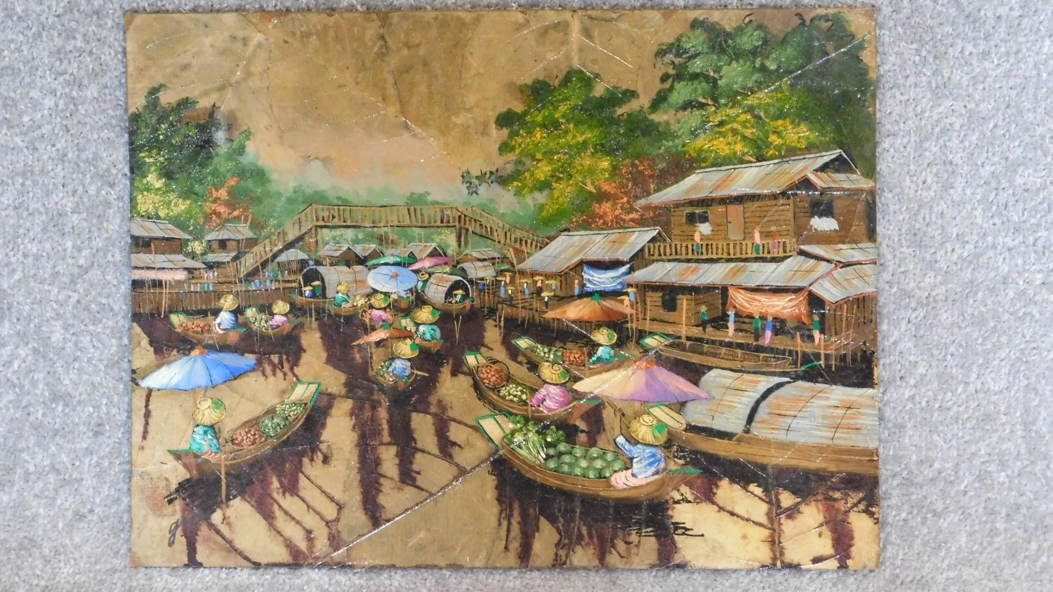 An oil painting on panel overlaid by tobacco leaves depicting a trading post on a lake. 30x40cm