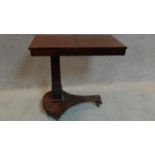 A mid Victorian mahogany adjustable reading stand on platform base and fitted brass casters.
