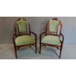 A pair of walnut framed Art Nouveau carved back armchairs. H.106cm