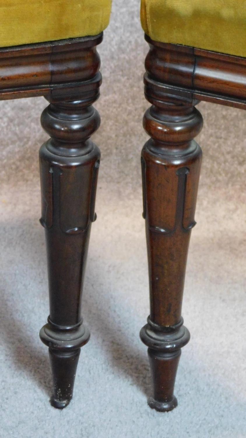 A set of four mid Victorian mahogany dining chairs with shaped backs, mustard upholstery on turned - Image 3 of 6