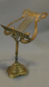 A brass table top music stand. H.49cm