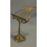 A brass table top music stand. H.49cm