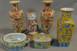 A collection of Chinese porcelain to include vases, tureens and a cat. H.40cm