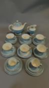 A Royal Doulton tea service in pale blue floral glaze.