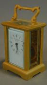 A gilt metal cased carriage clock marked Nathan and Co. 12x6cm