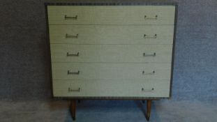 A vintage formica veneer chest of drawers, makers label to drawer lining. 94x92x43cm