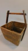 A vintage teak Chinese wooden basket. 53x38cm