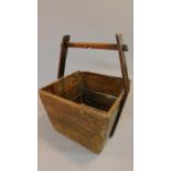 A vintage teak Chinese wooden basket. 53x38cm