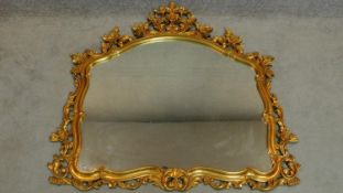 A carved wood gilt framed Florentine style overmantel mirror. 115x114cm