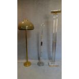 A collection of three various standing lamps. H.183cm