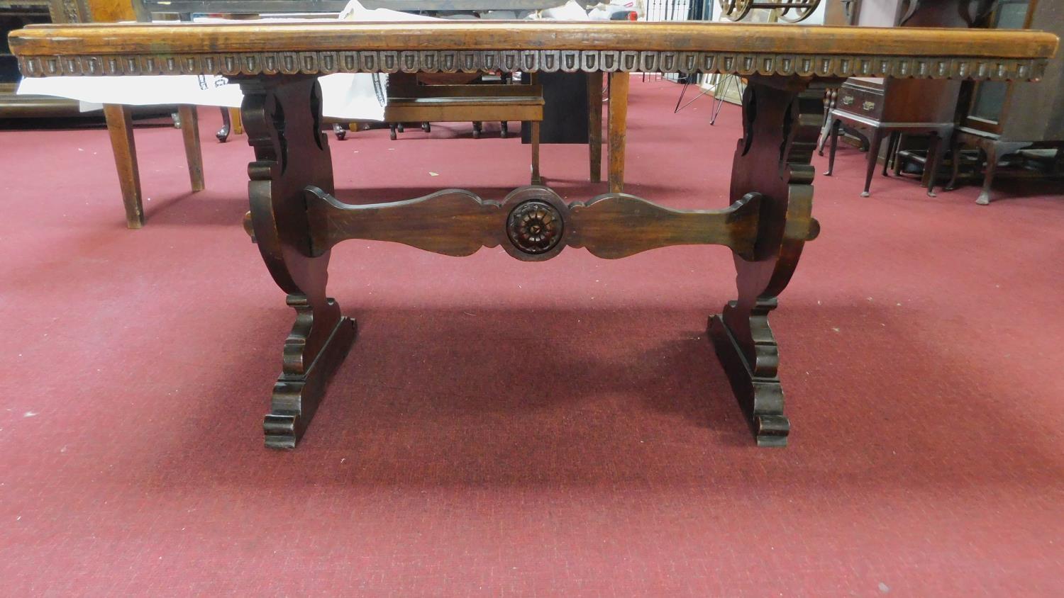 A continental oak refectory table with urn carved stretchered trestle ends. 76x150x72cm - Image 2 of 7