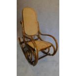 A bentwood caned rocking chair. H.104 W.52 D.97cm