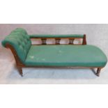 A late Victorian walnut framed chaise longue in green upholstery on turned supports. 75x165x67cm